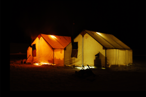 Canvas Wall Tents Glowing in the Arctic