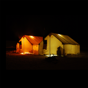 Canvas Wall Tents Glowing in the Arctic